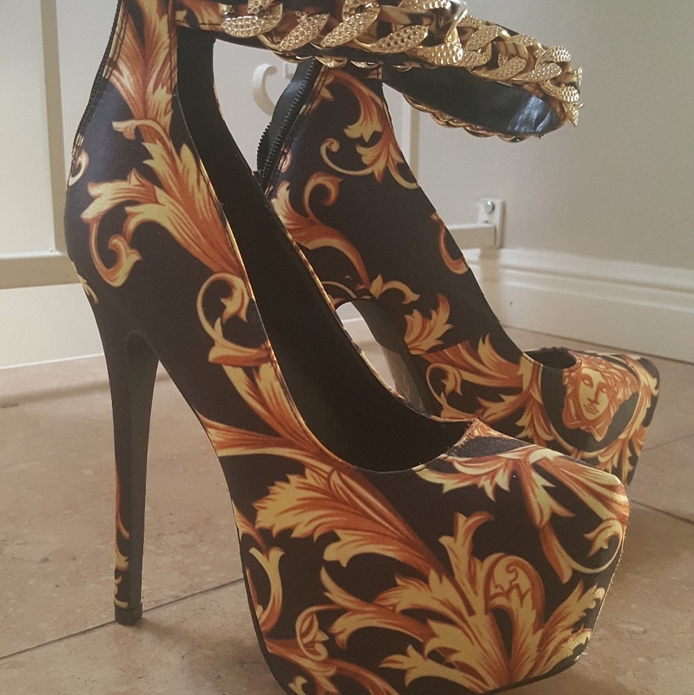 Black and gold platform pumps